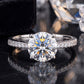10k white gold round brilliant lab-grown diamond solitaire engagement ring with pave band on black reflective surface