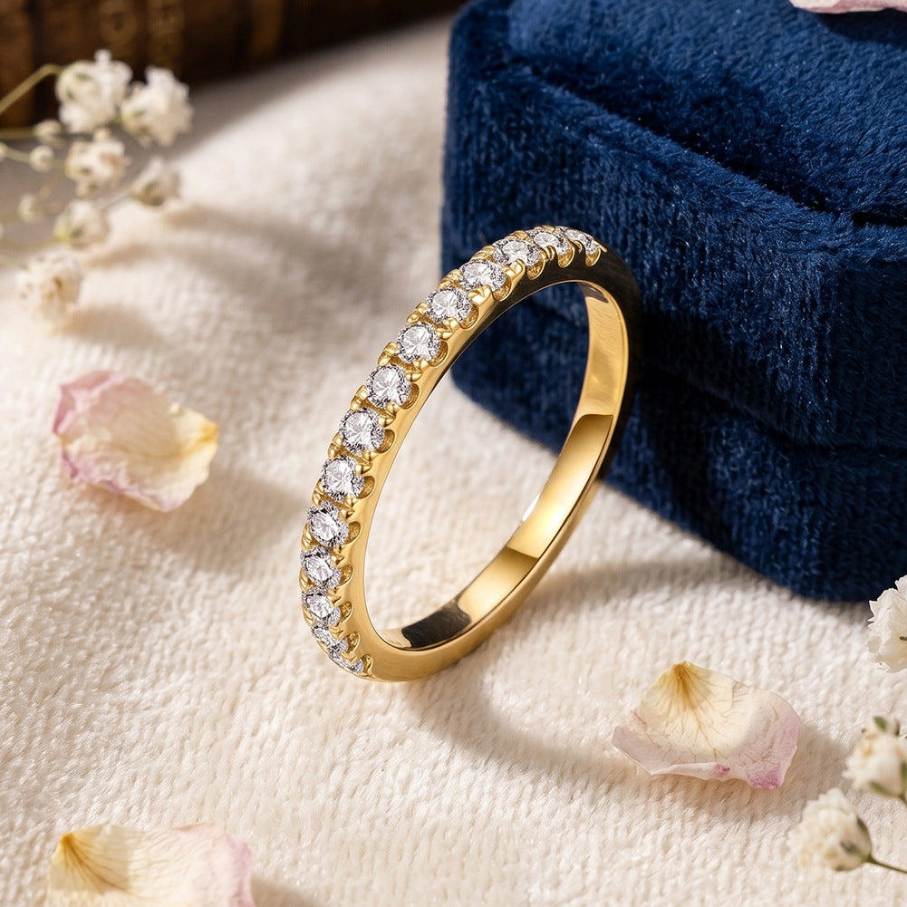 10kt yellow gold round brilliant lab diamond half eternity ring resting against blue velvet ring box