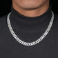 Chain worn as bold men's statement. Alt: “Men's Iced Out Cuban Chain – 10mm.”