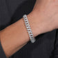 Chain worn as bold men's statement. Alt: “Men's Iced Out Cuban Chain – 10mm.”