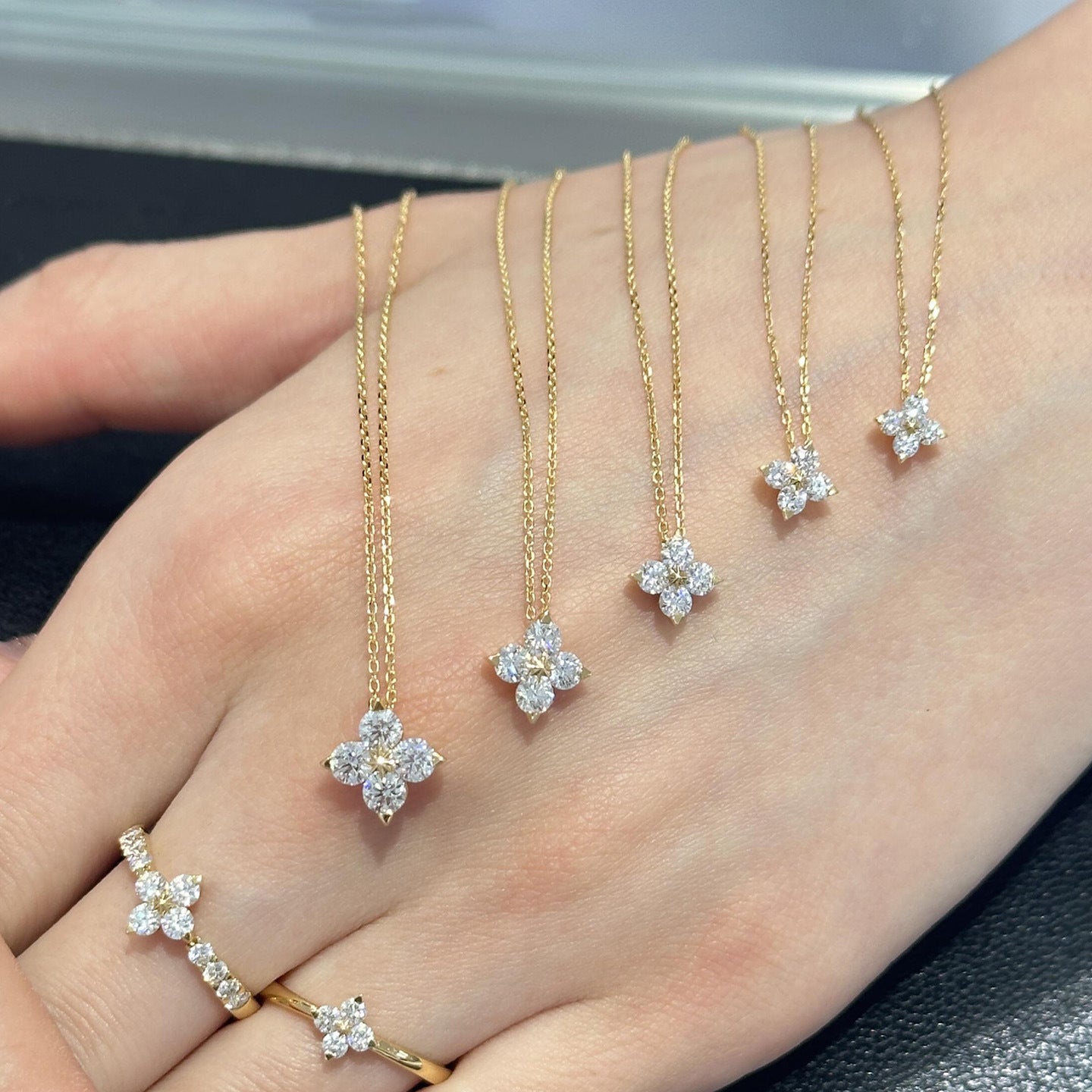  Clover pendant on soft green or cream background. Alt: “14K Gold-Plated Moissanite Four-Leaf Clover Necklace.”