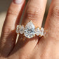 Model wearing 14k yellow gold pear cut lab-grown diamond five-stone engagement ring on hand