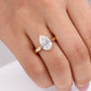 Model wearing 14k yellow gold pear cut lab-grown diamond hidden halo engagement ring on hand