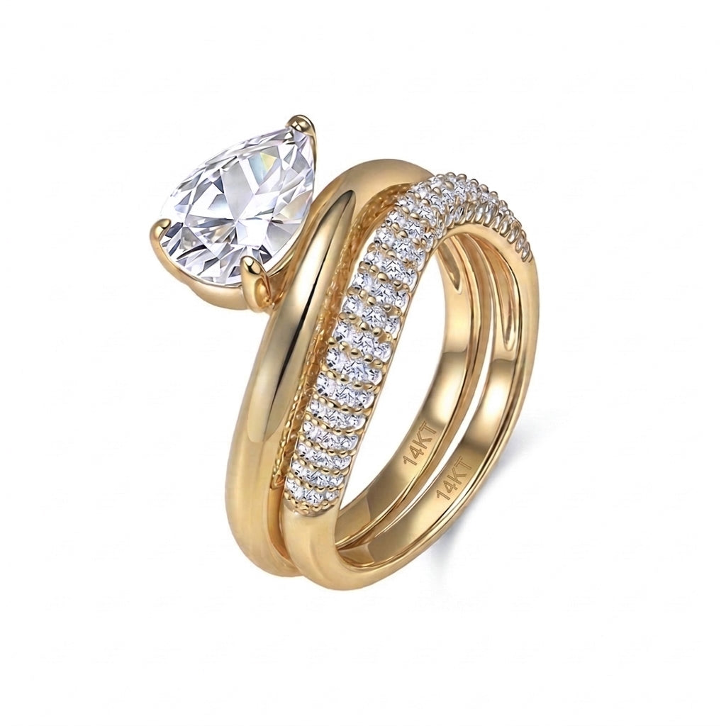 14k yellow gold pear cut lab diamond solitaire engagement stacking ring set with pave band isolated on white background