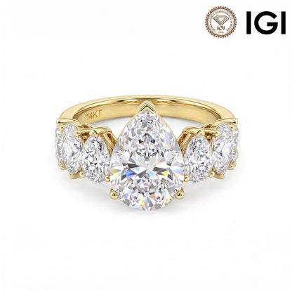 14k yellow gold pear cut lab-grown diamond five-stone engagement ring with IGI logo on white studio background