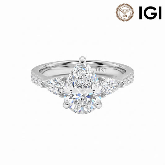 14k white gold pear shape three-stone lab-grown diamond engagement ring with pave band and IGI logo on white studio background