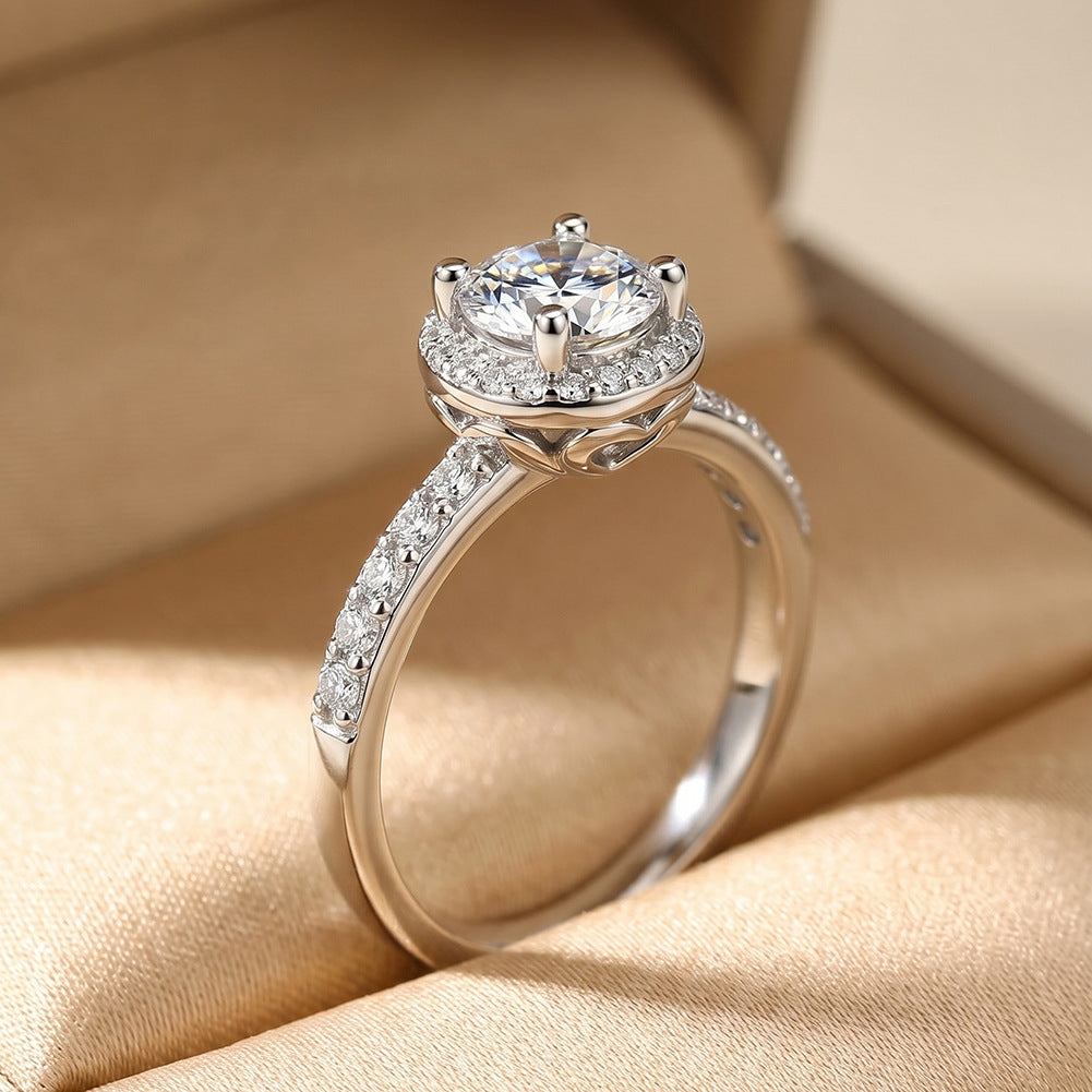 Side view profile of 14k white gold round lab diamond halo engagement ring in velvet box showing setting details   