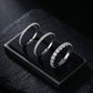 Three 14kt white gold round brilliant lab diamond half eternity rings on black velvet display stand