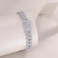 High-definition shot of the bracelet laid flat and fully extended on pure white.