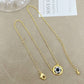 ZERRA Kendra Scott volleyball gold short pendant necklace with a round pendant on a delicate chain, perfect for casual or elegant wear.