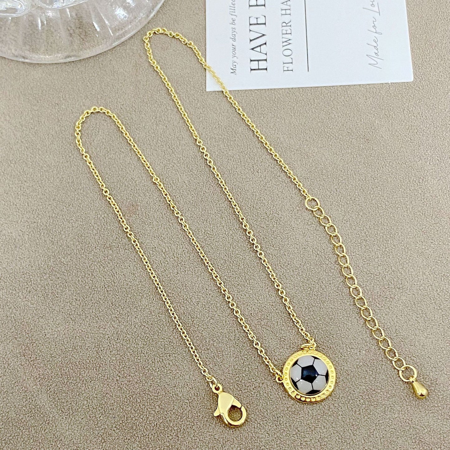 ZERRA Kendra Scott volleyball gold short pendant necklace with a round pendant on a delicate chain, perfect for casual or elegant wear.