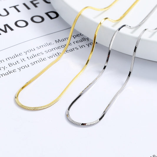  Flat snake chain on neutral background. Alt: “18K Gold-Plated Flat Snake Chain Necklace – Unisex Blade Chain.”