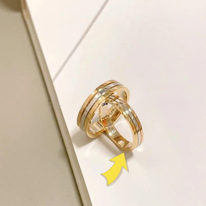 18K Gold-Plated Sterling Silver Couple Rings Small sizeTwo gold rings with a yellow arrow pointing to one of them on a light background