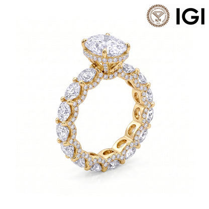 18k yellow gold oval cut lab diamond engagement pave ring with eternity band and IGI logo on white studio background