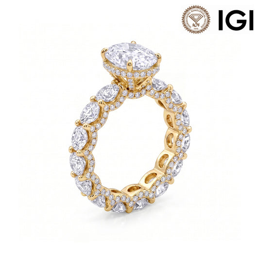 18k yellow gold oval cut lab diamond engagement pave ring with eternity band and IGI logo on white studio background
