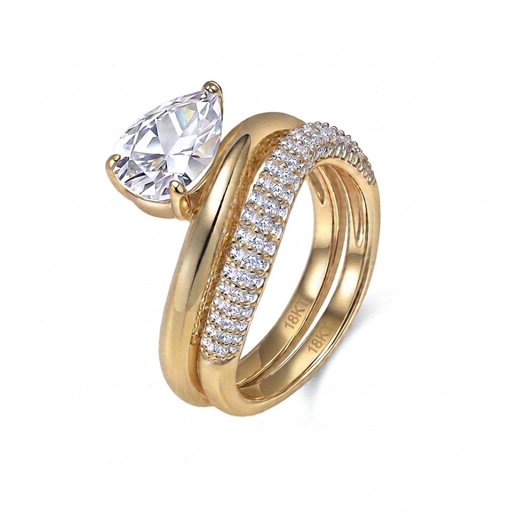 18k yellow gold pear cut lab diamond solitaire engagement stacking ring set with pave band isolated on white background