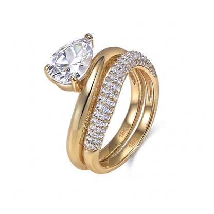 18k yellow gold pear cut lab diamond solitaire engagement stacking ring set with pave band isolated on white background