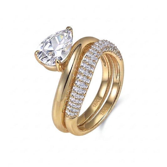 18k yellow gold pear cut lab diamond solitaire engagement stacking ring set with pave band isolated on white background