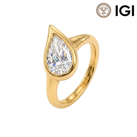 18k yellow gold pear shape lab-grown diamond bezel setting solitaire engagement ring with IGI logo on white studio background   