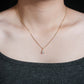 Model wearing 18k rose gold 1 carat pear cut lab-grown diamond clavicle pendant necklace