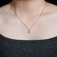 Model wearing 18k rose gold 1 carat radiant cut lab-grown diamond clavicle pendant necklace