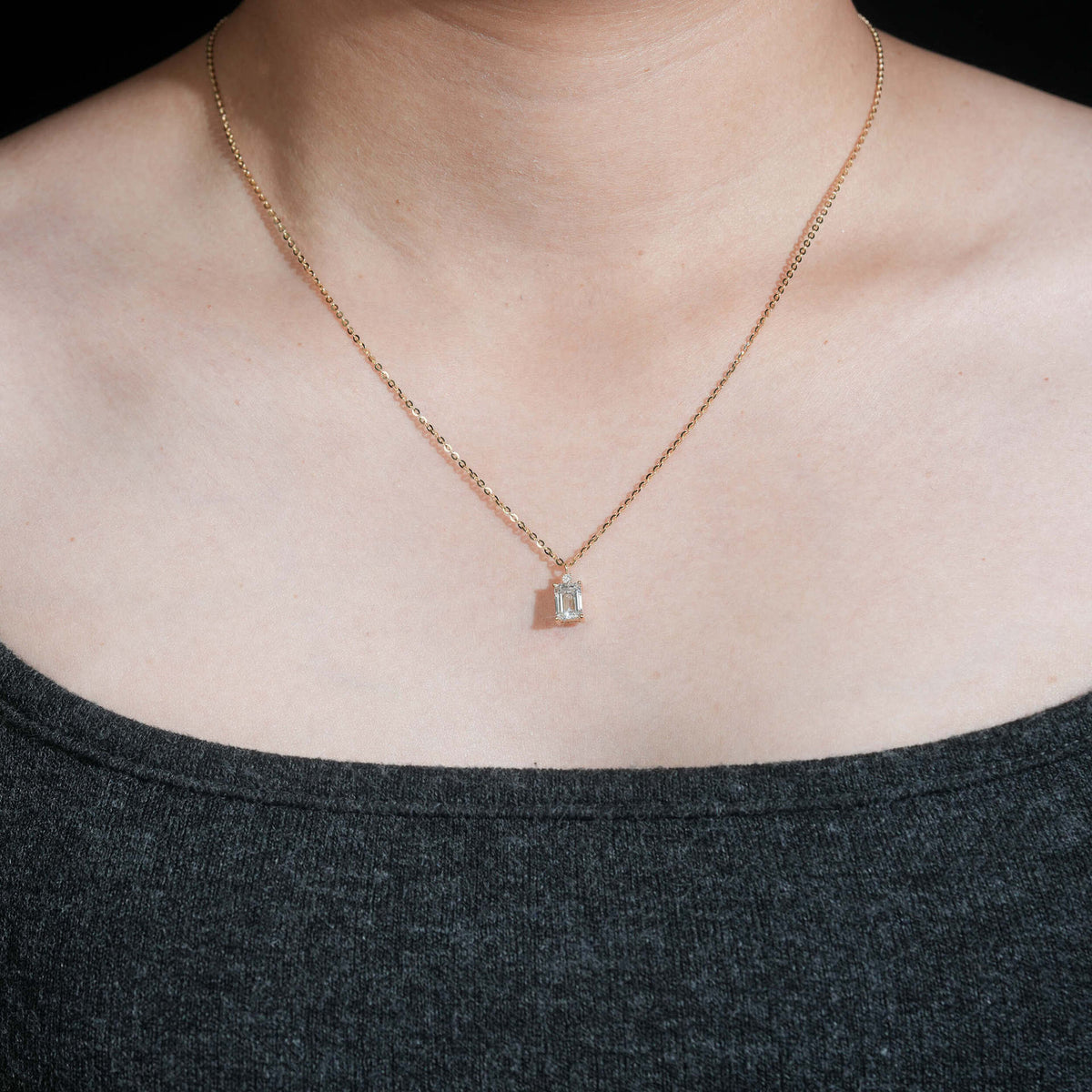 Model wearing 18k rose gold 1 carat radiant cut lab-grown diamond clavicle pendant necklace