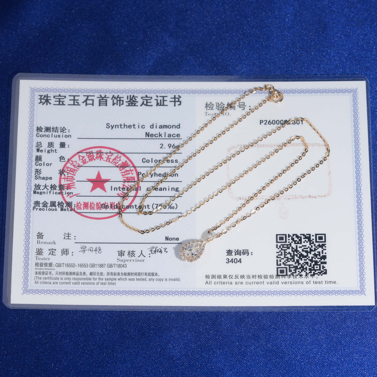 18k rose gold 1 ct pear halo lab-grown diamond clavicle pendant necklace displayed with jewelry certificate