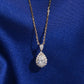 18k rose gold 1 ct pear halo lab-grown diamond clavicle pendant necklace on royal blue silk background