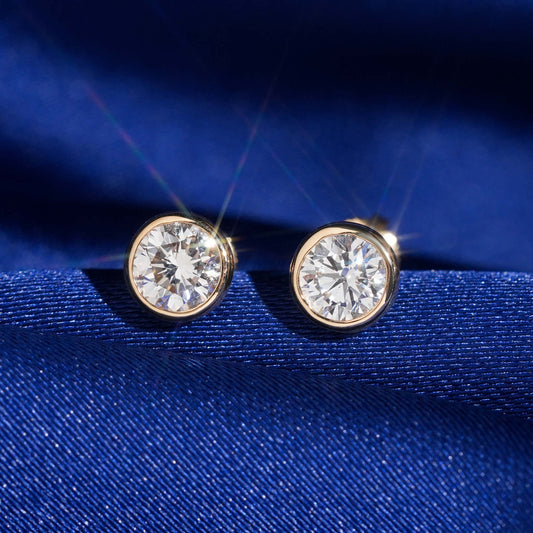18k rose gold 5mm bezel-set solitaire lab-grown diamond stud earrings sparkling on royal blue silk fabric