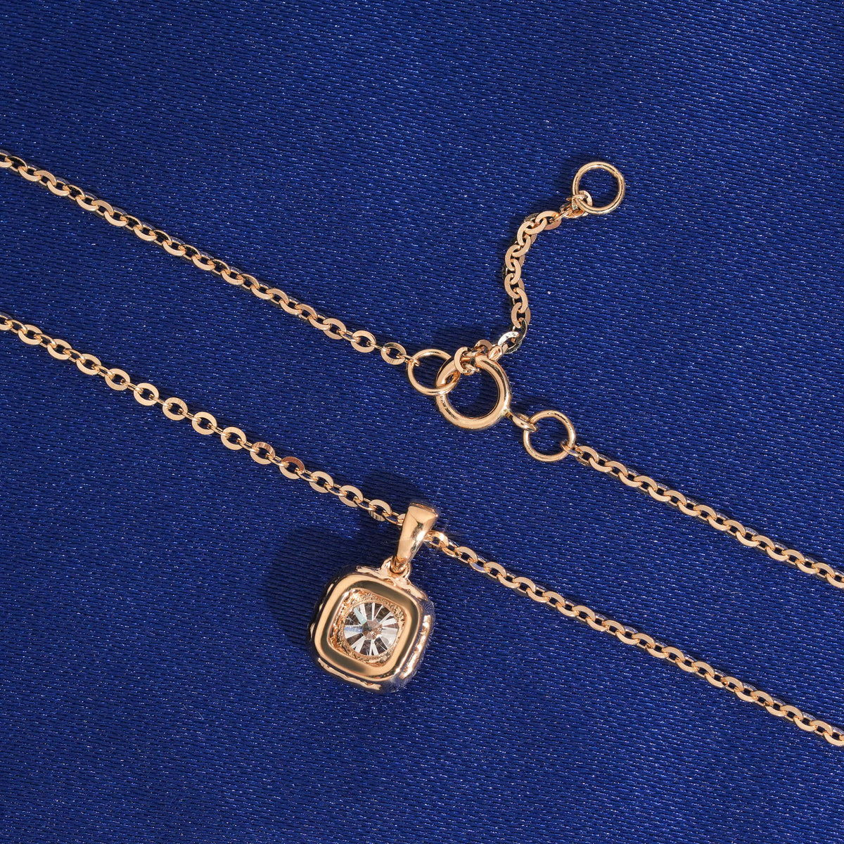 Back view of cushion square halo setting and spring ring clasp of 18k rose gold diamond pendant necklace