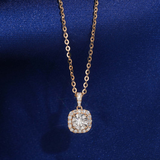 18k rose gold 5mm cushion square halo lab-grown diamond pendant necklace on royal blue silk background