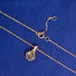 Back view of round halo setting and spring ring clasp of 18k rose gold diamond clavicle pendant necklace