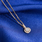 Close up view of 5mm round halo lab-grown diamond pendant with pave bail in 18k rose gold setting