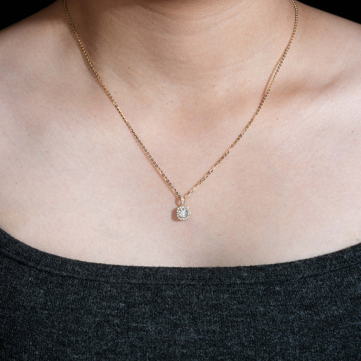 Model wearing 18k rose gold 5mm round halo lab-grown diamond clavicle pendant necklace