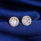 18k rose gold 5mm round halo lab-grown diamond stud earrings sparkling on royal blue silk fabric