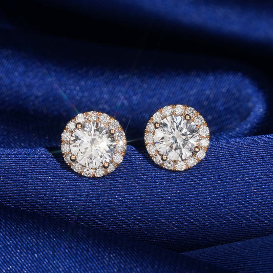 18k rose gold 5mm round halo lab-grown diamond stud earrings sparkling on royal blue silk fabric