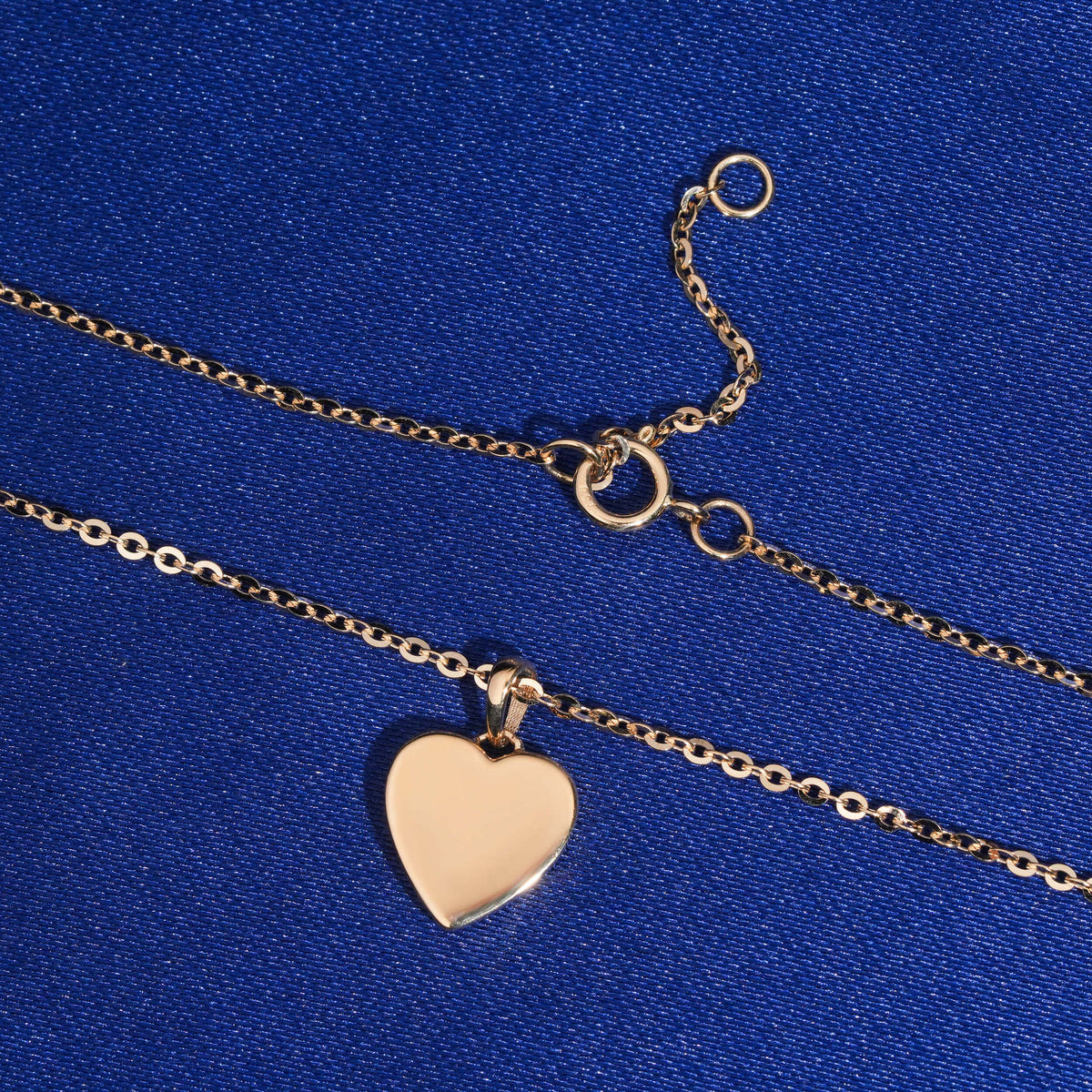 Smooth polished back and spring ring clasp of 18k rose gold diamond heart pendant necklace