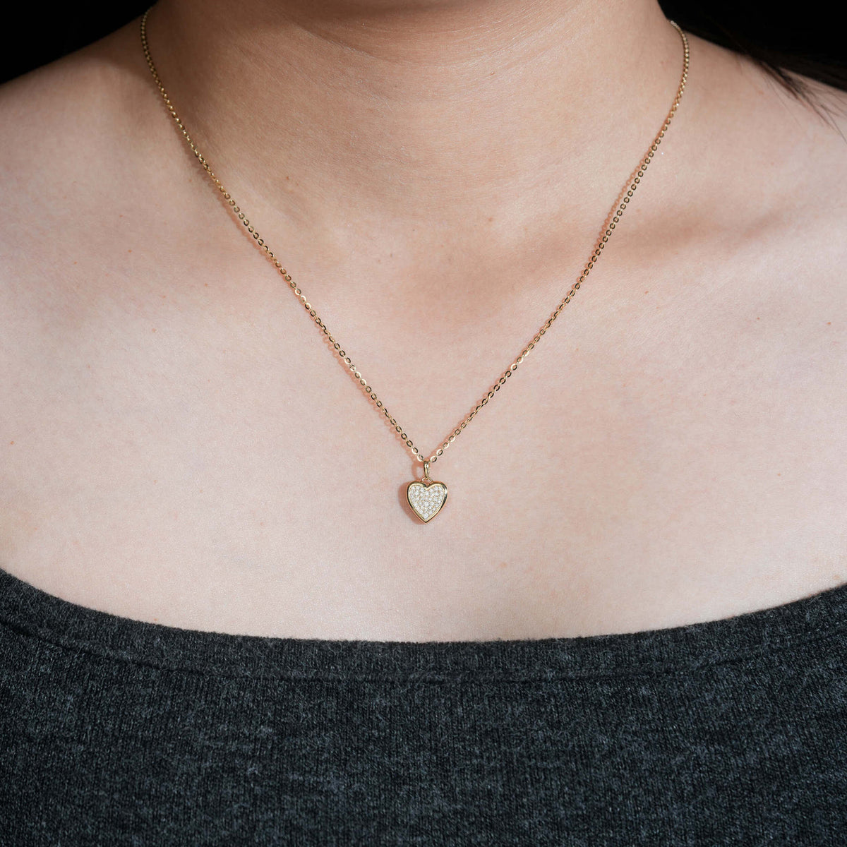Model wearing 18k rose gold pave lab-grown diamond heart pendant necklace   