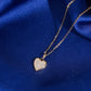Close up view of pave setting on 18k rose gold lab-grown diamond heart pendant necklace   