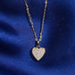 18k rose gold pave lab-grown diamond heart pendant necklace on royal blue silk background