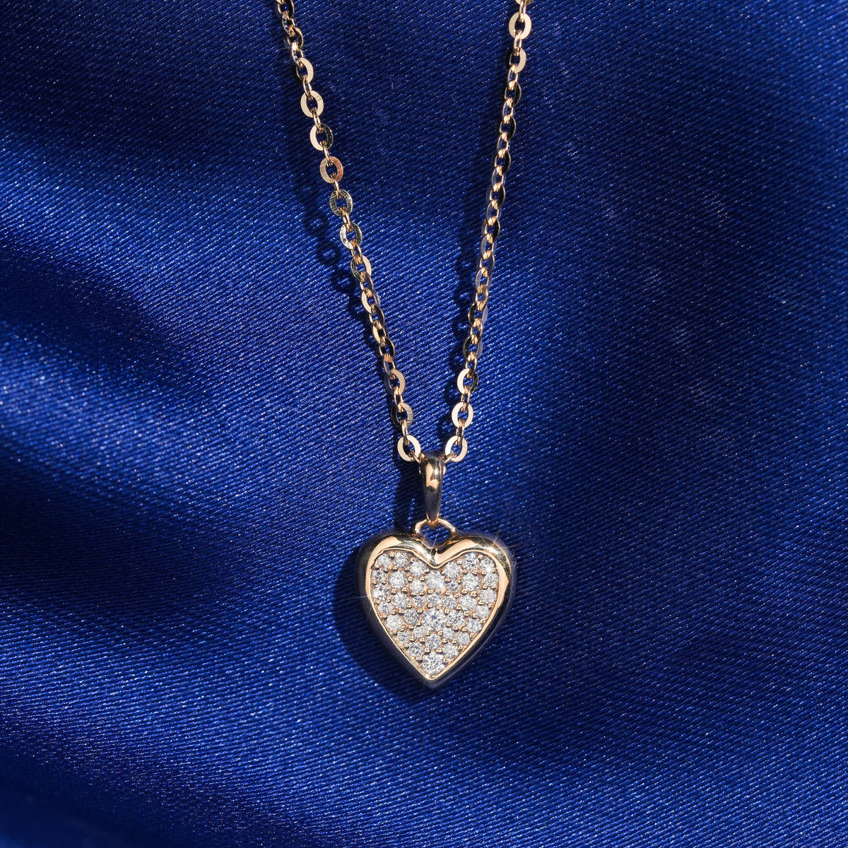 18k rose gold pave lab-grown diamond heart pendant necklace on royal blue silk background