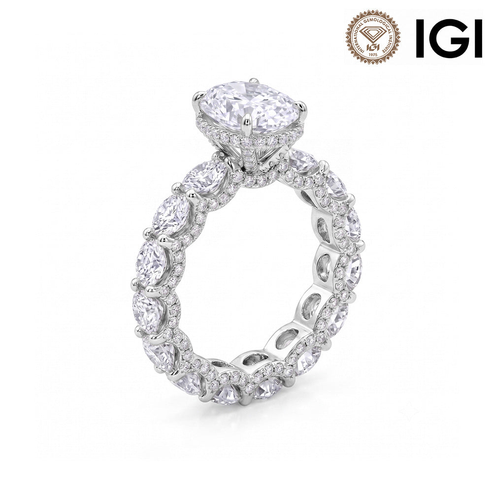 18k white gold oval cut lab diamond engagement pave ring with eternity band and IGI logo on white background