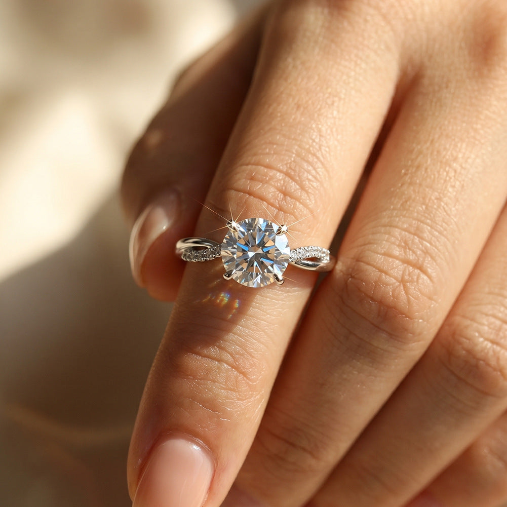 Model wearing 18k white gold round cut lab-grown diamond twist vine solitaire engagement ring on hand