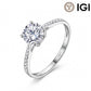 18k white gold round brilliant lab-grown diamond solitaire engagement ring with pave band and IGI logo on white studio background