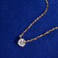 Angle view of 18k yellow gold 5.5mm solitaire lab-grown diamond pendant necklace on blue fabric