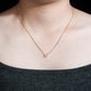 Model wearing 18k yellow gold 5.5mm solitaire lab-grown diamond pendant necklace   