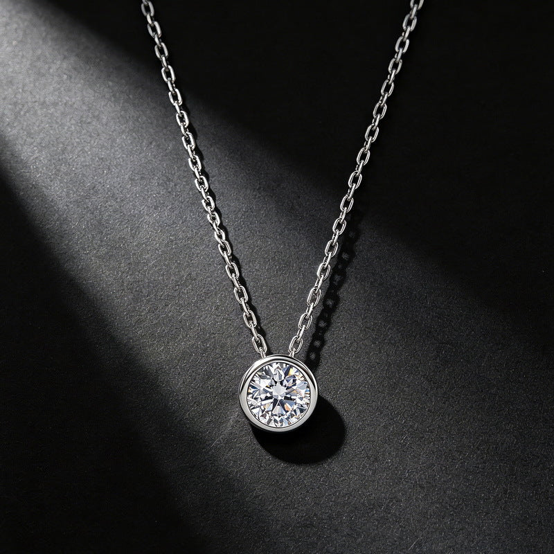 1CT round bezel solitaire floating diamond necklace displayed on dark textured background.