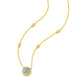 Detailed view of 18K yellow gold 1CT lab grown diamond halo pendant and station chain.