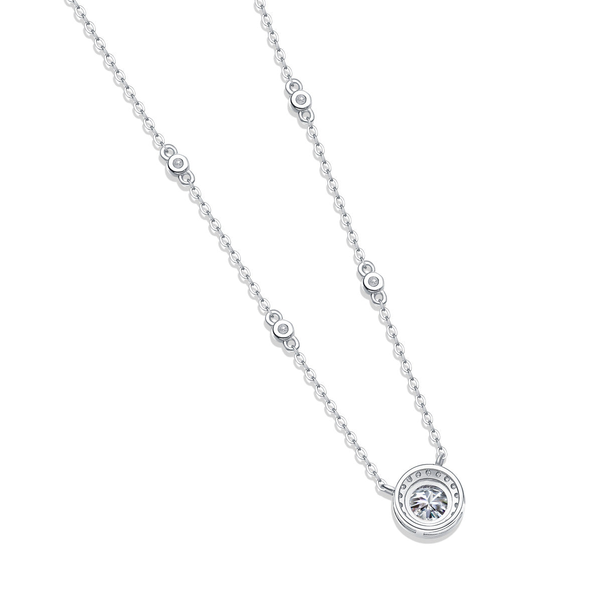 White gold 1CT lab grown diamond halo station necklace resting on plain background.