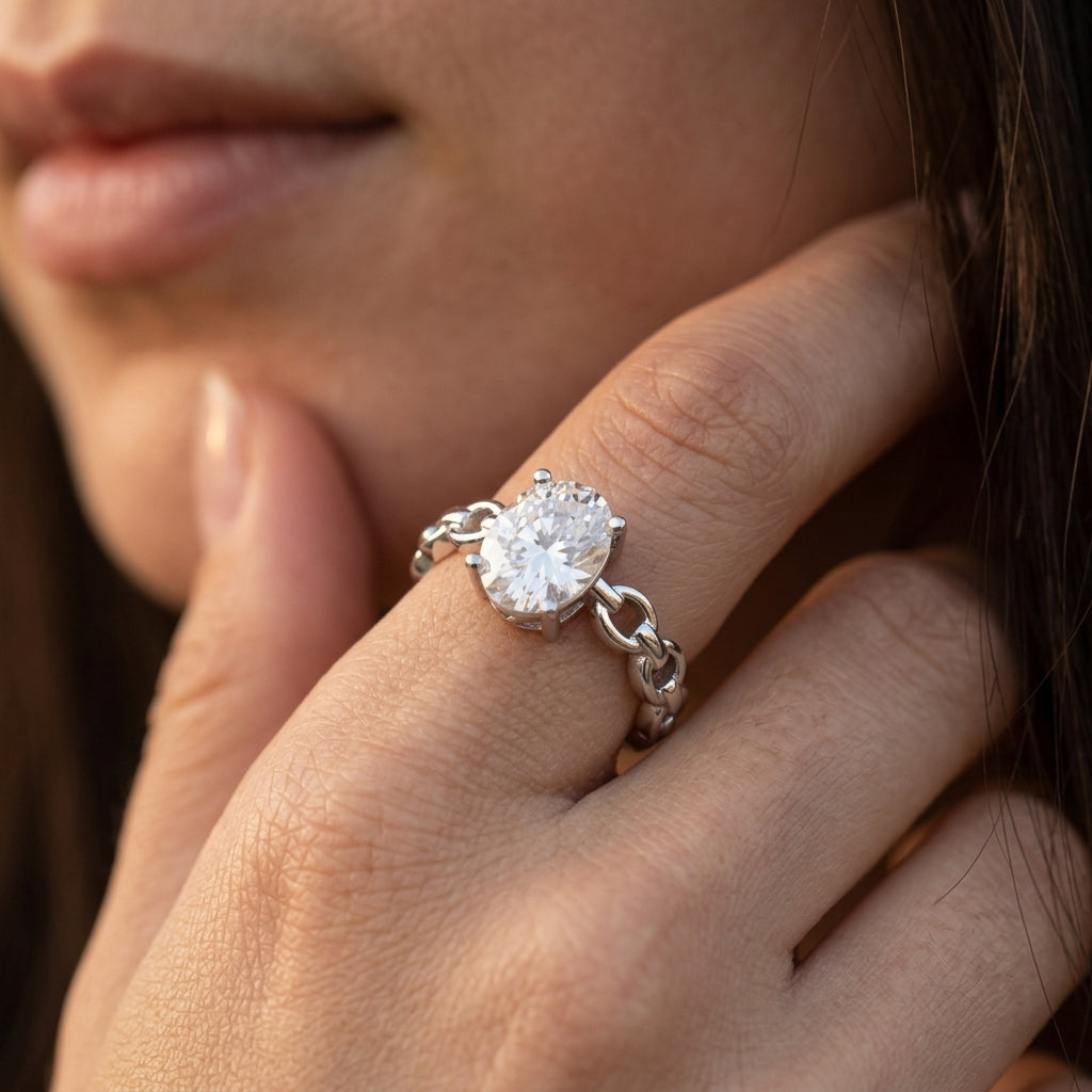 Close-up view of a model wearing 1ct oval cut moissanite chain link engagement ring.